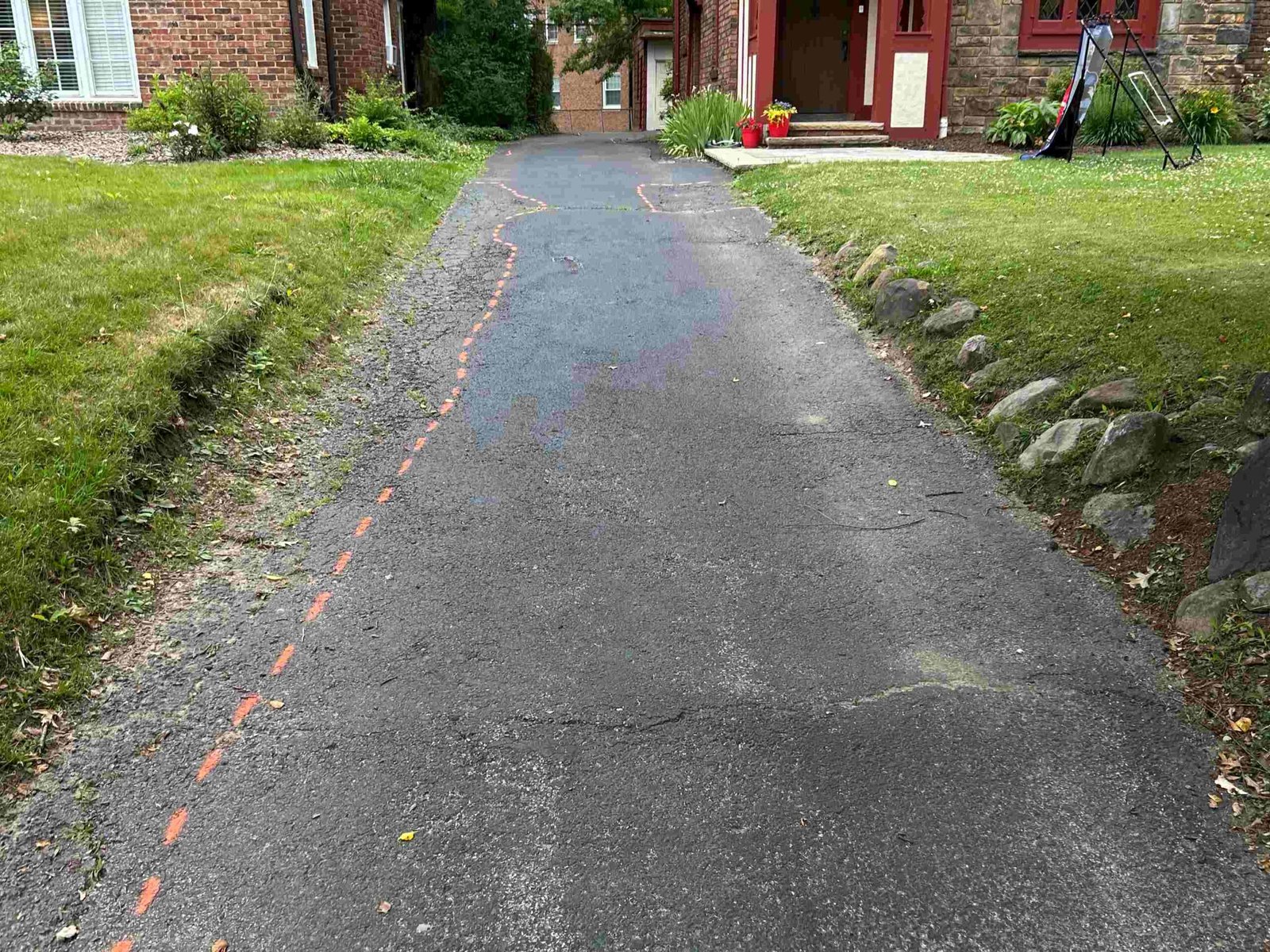 Worn cracked asphalt surface before seal coating