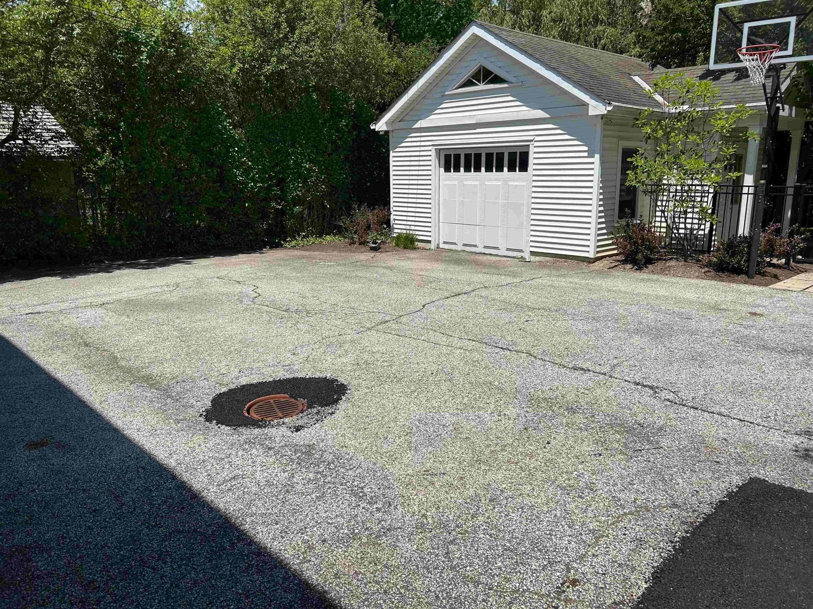 Worn cracked asphalt surface before seal coating